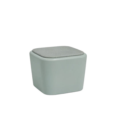 Stat Medical Inc Flo BH occasional table in sage green with a grey upholstered top and rounded safety edges.
