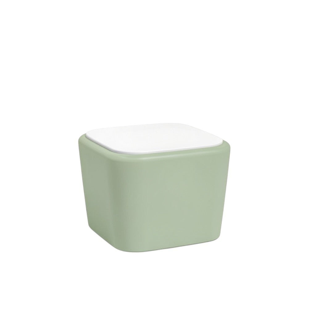 Stat Medical Inc Flo BH occasional table with a sage green base and white top, featuring rounded safety edges.